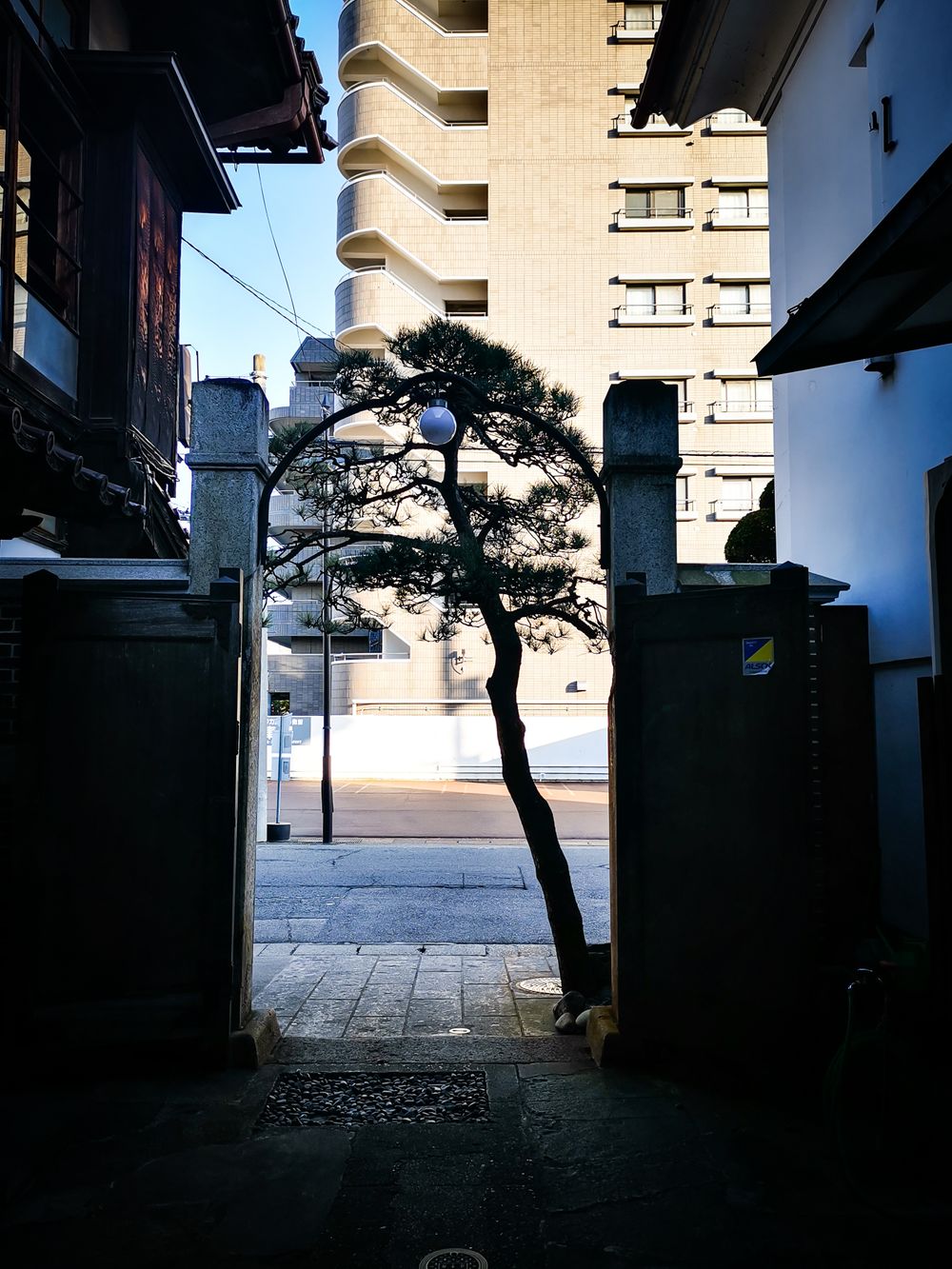 by the entrance of the sake house